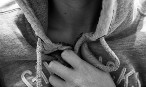 Holding back the goods underneath a sweatshirt