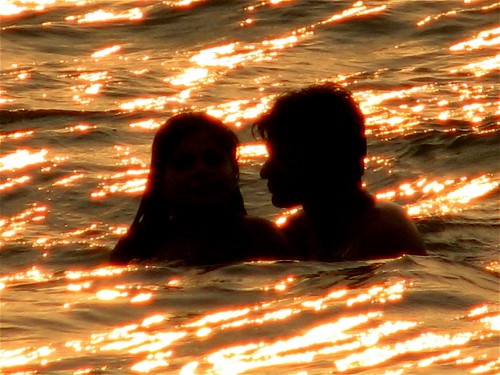 Intimate moment with a couple, in the ocean