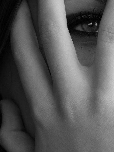 Conscience A woman, behind her hand.