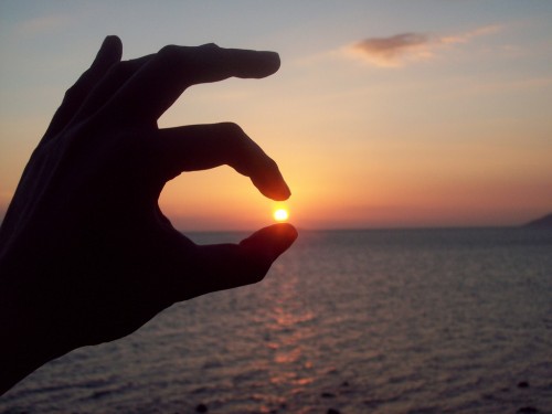 D-lite Prospective of someone, pinching the sunset