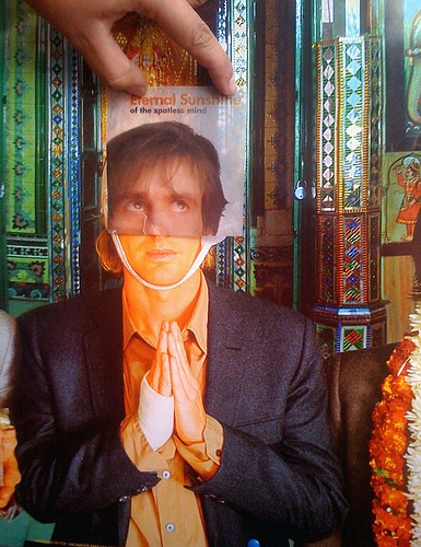 Francis/Joel Man, praying, with the poster of "Eternal Sunshine of a Spotless Mind"